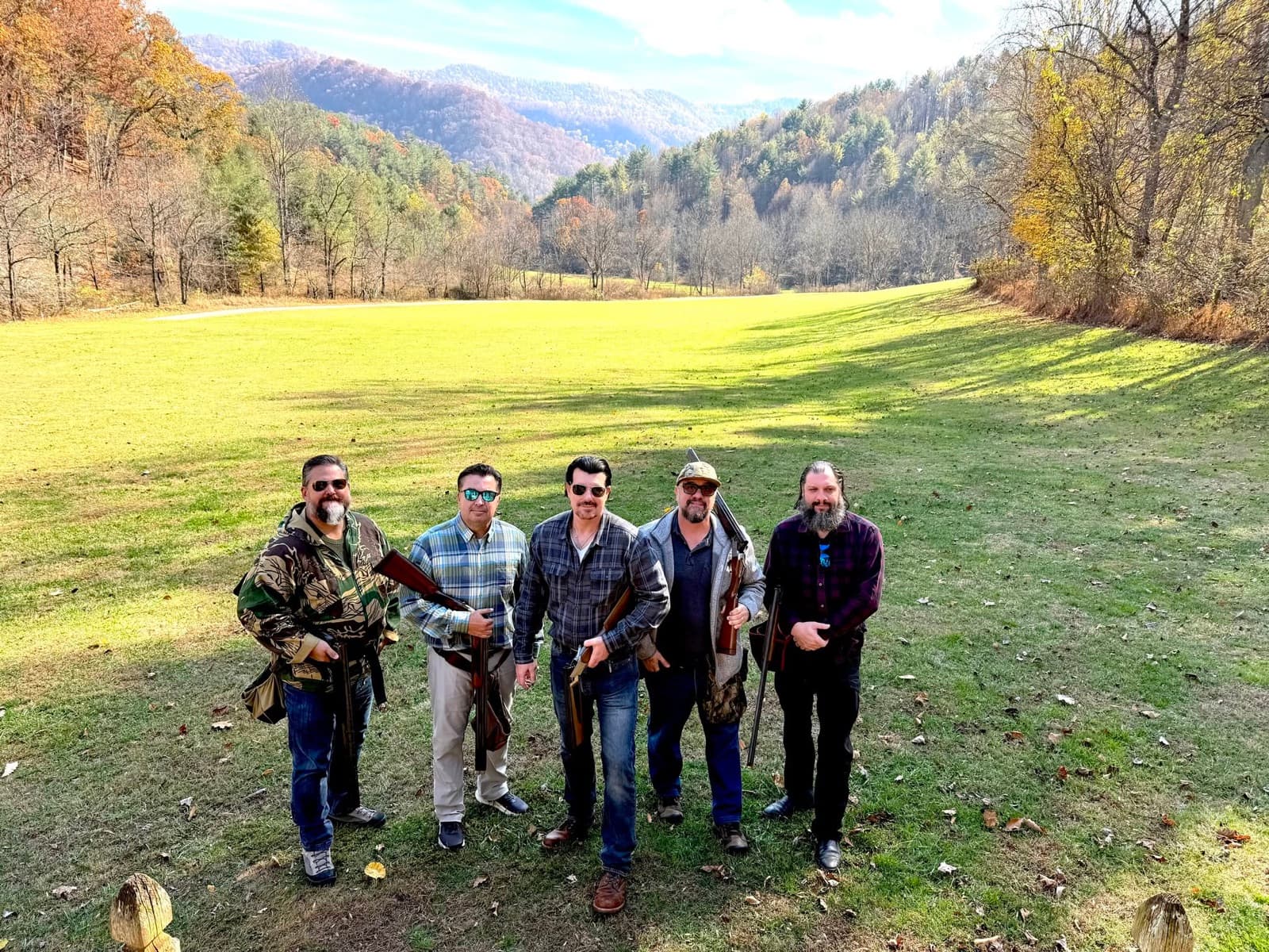 Chuck and four RMH members on a shooting-clays outing in an autumn valley.