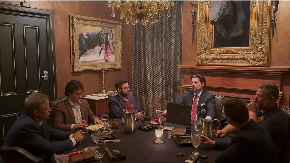 RMH members and Chuck gathered around a table for discussion.